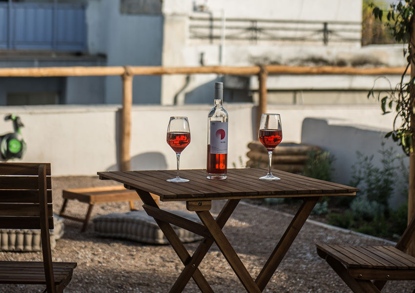 red wine on table at roofgarden Athens